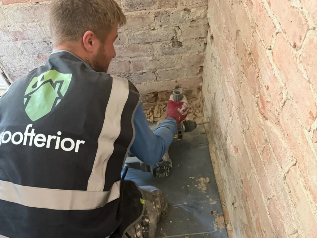 Proofterior specialist installing a chemical DPC on a Dorset property
