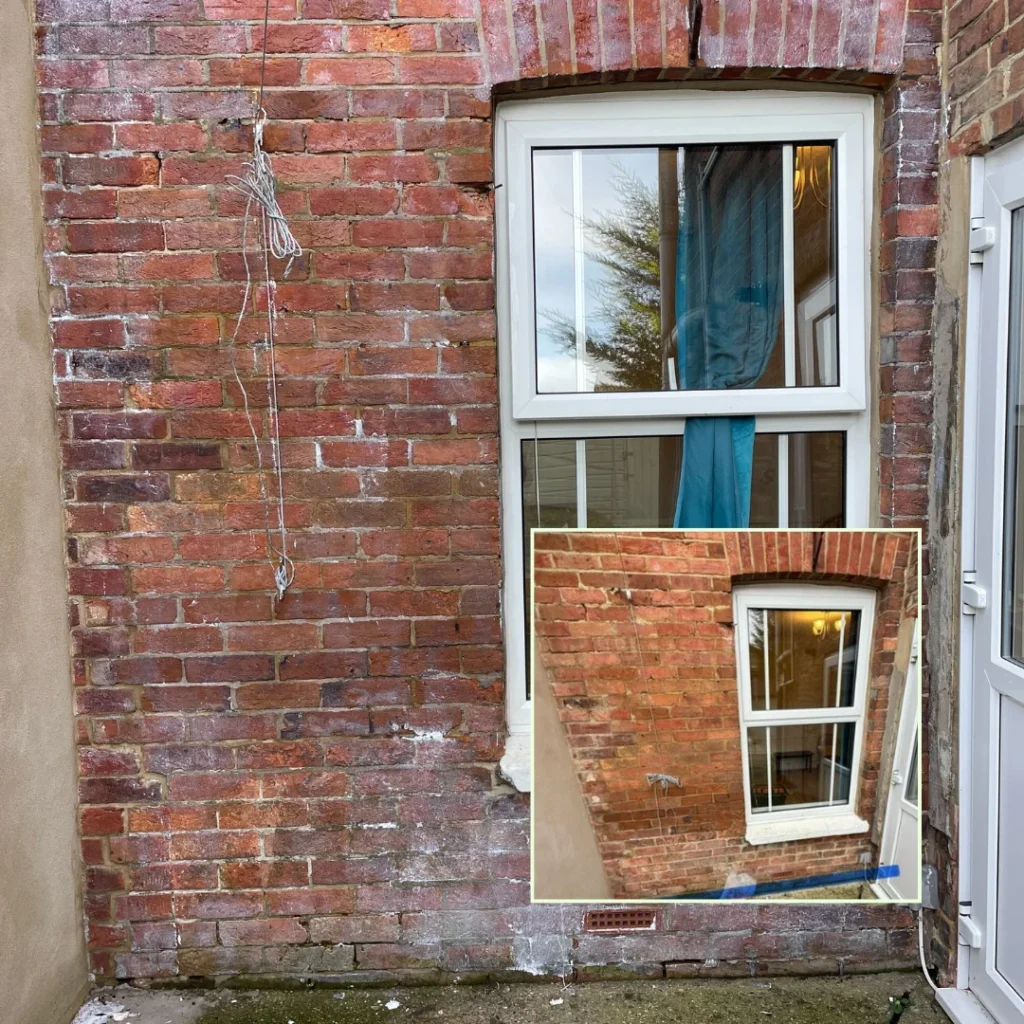 External brickwork of a home property showing damp investigation markings at ground level to assess rising damp and moisture penetration.