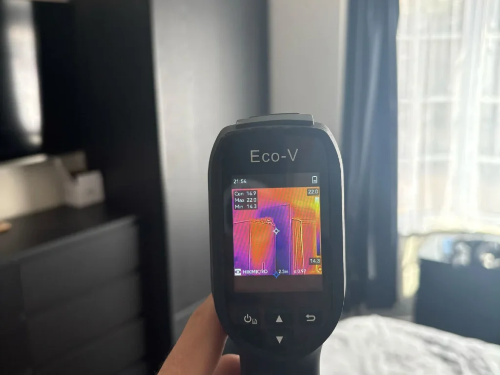 Moisture meter readings being taken on an internal wall during a Proofterior survey