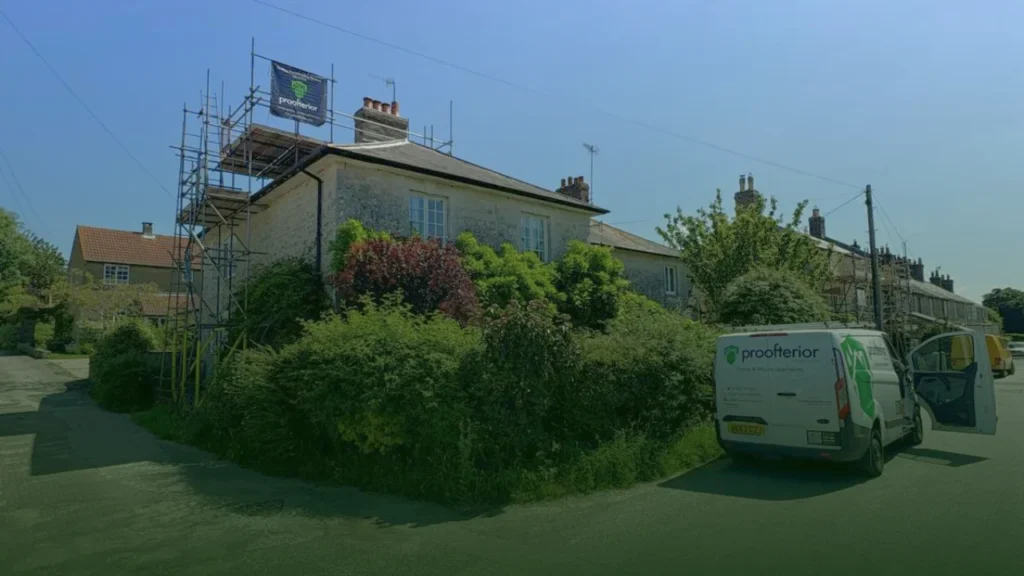 Stone-built house in Dorset under Proofterior scaffolding