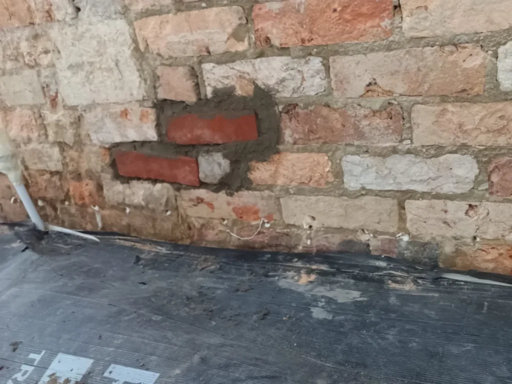 Brickwork repaired after damp proof course installation