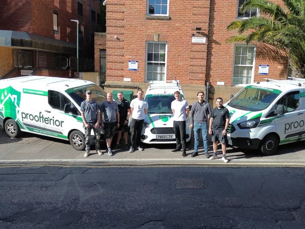 The Proofterior team with their liveried vans