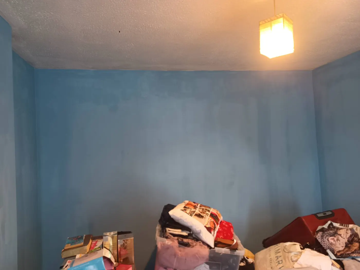 Bedroom redecorated after mould treatment, with no mould at the ceiling line