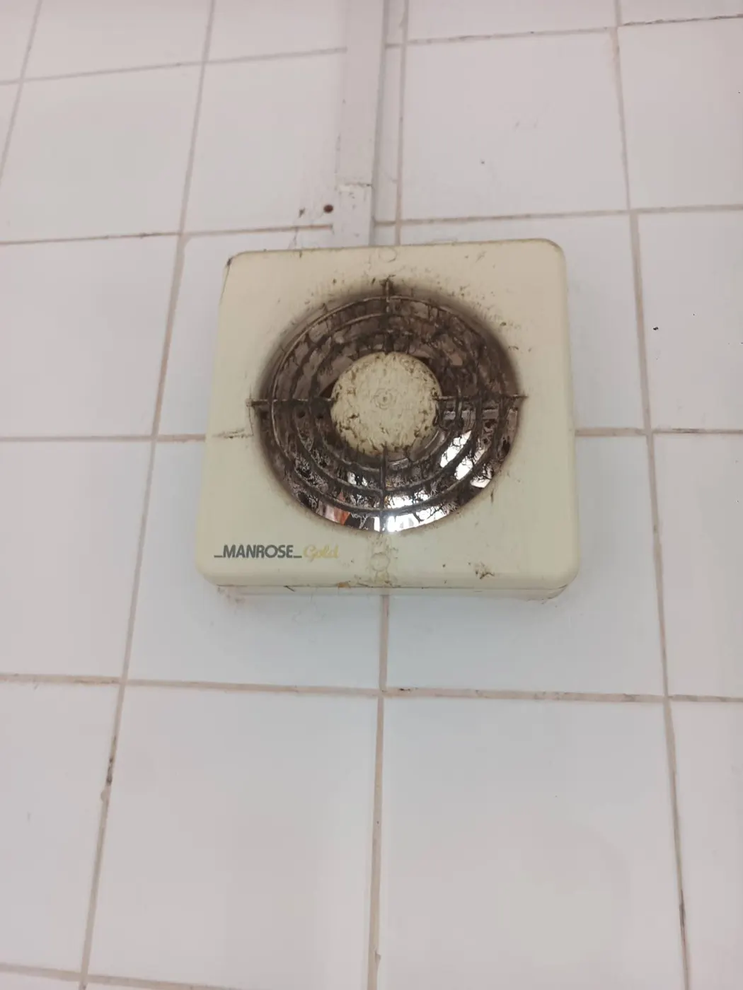 Old, undersized bathroom extractor fan that was not removing enough moist air