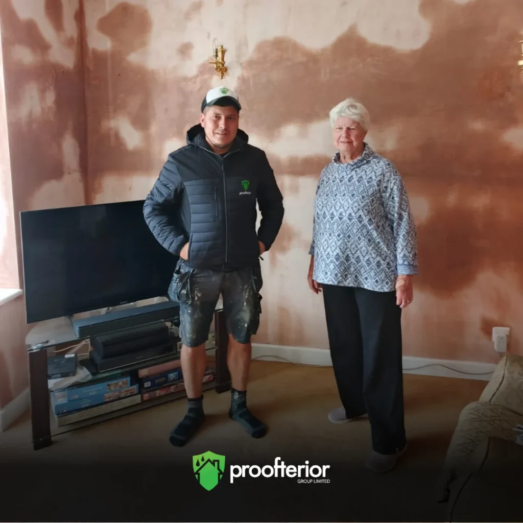 Proofterior damp proofing specialist with Dorset homeowner after wall restoration project.