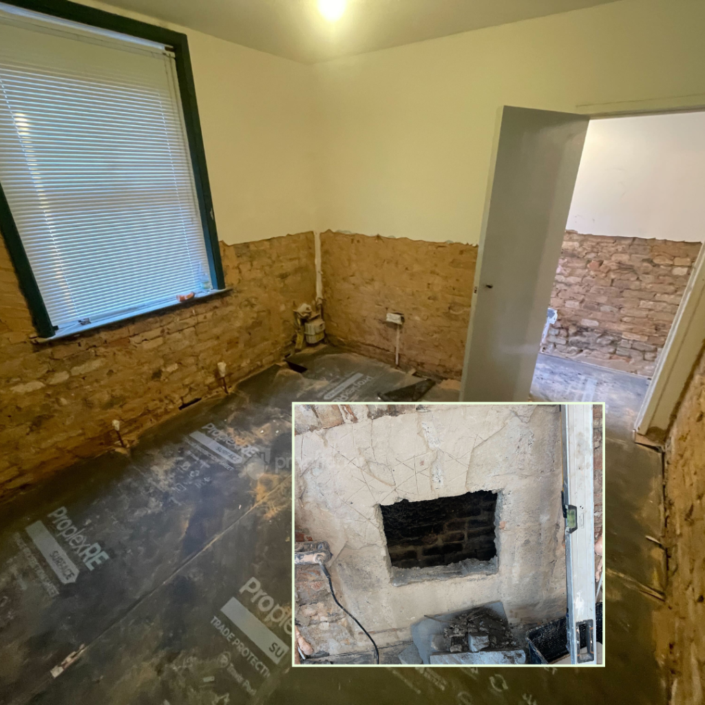 Internal ground floor room with contaminated plaster removed during damp investigation in a Victorian home, exposing brickwork affected by rising damp.