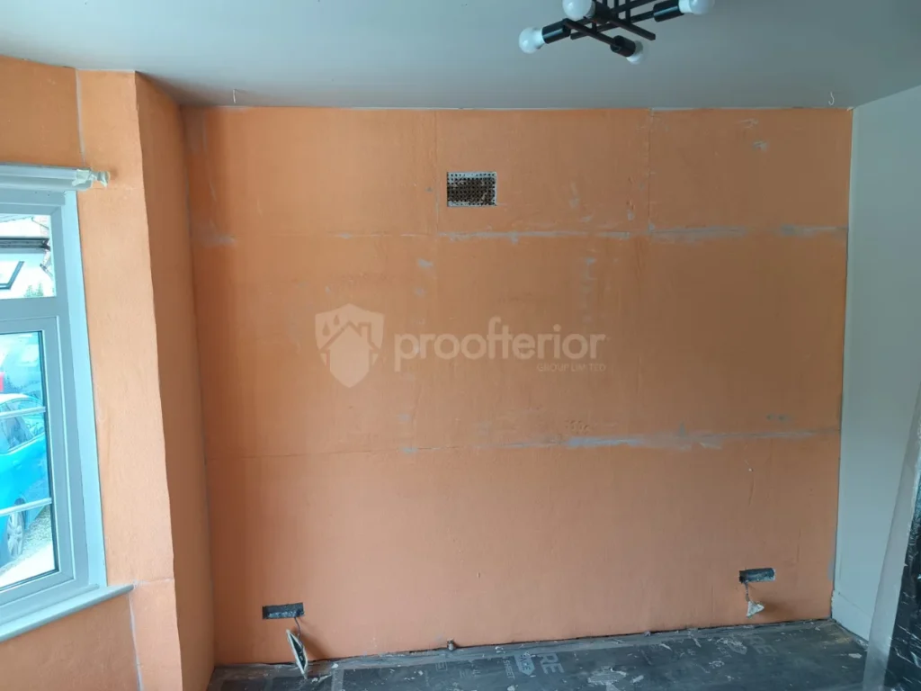 Internal view of a Bournemouth bedroom being plastered with thermal-regulating material to eliminate condensation and provide a smooth finish.