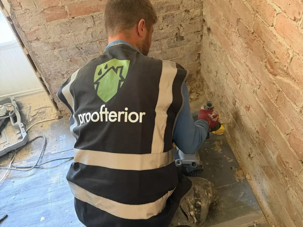 A qualified Proofterior damp specialist standing by a service van in Southampton, ready to perform a technical survey for rising and penetrating damp.