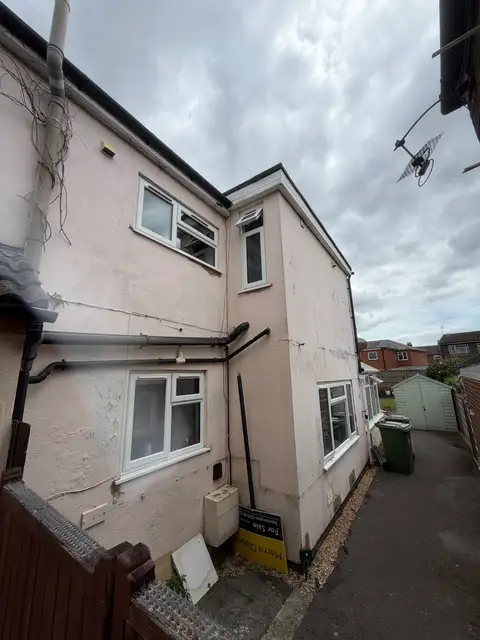 Flaking paint and cracked render on a Southampton, SO15 property before exterior restoration